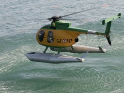 6)-05 Guarda di Finanza NH500 just about to land on the Adriatic Sea off Rimini